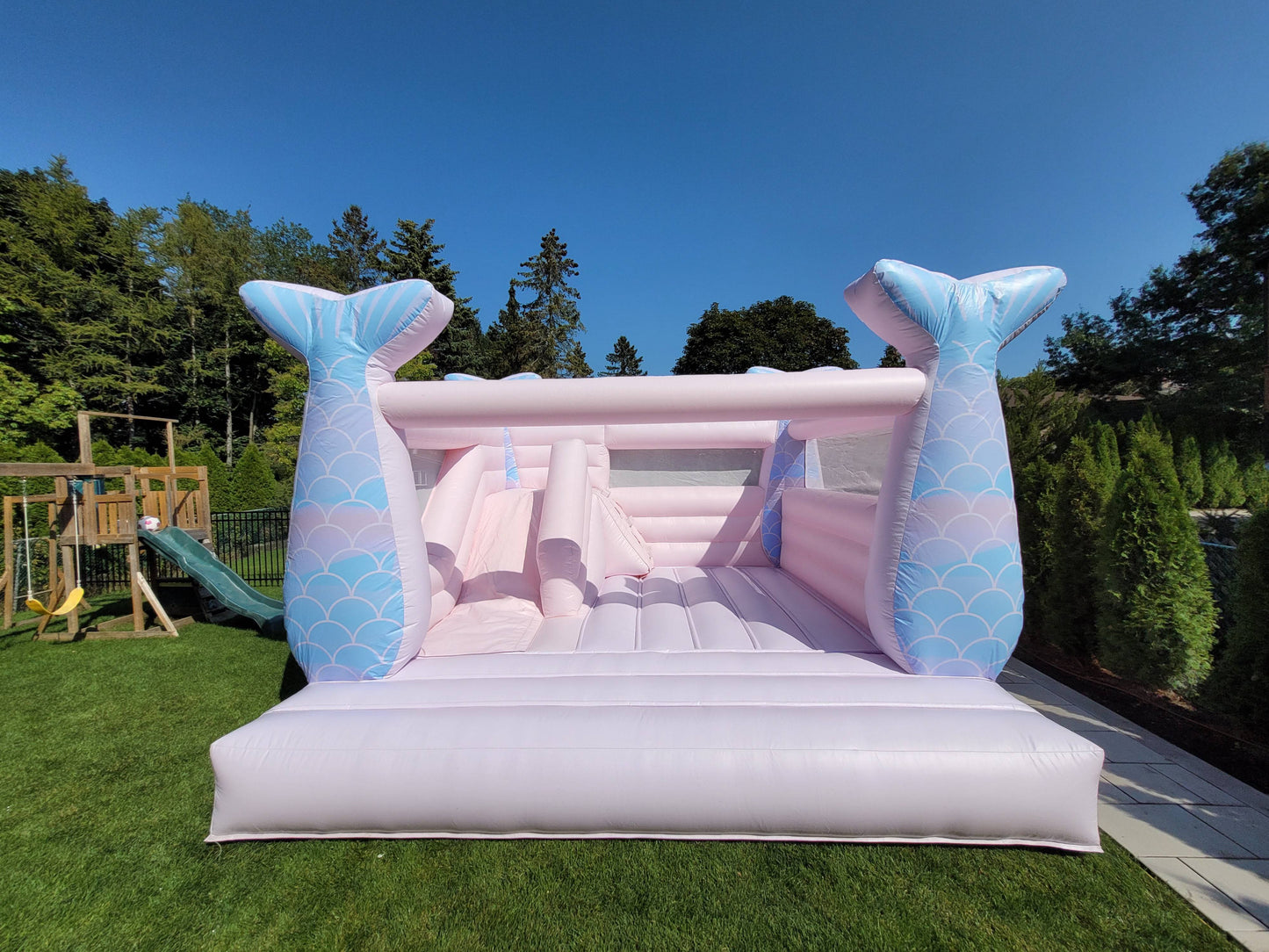 Colorful 14ft Mermaid Castle bouncy castle by Aura Luxury Rental Ltd, featuring vibrant mermaid and ocean-themed designs.