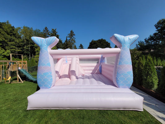 Colorful 14ft Mermaid Castle bouncy castle by Aura Luxury Rental Ltd, featuring vibrant mermaid and ocean-themed designs.