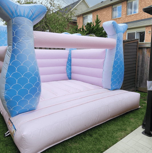 Mini Mermaid Castle toy from Aura Luxury Rental Ltd featuring colorful castle and mermaid figures on a play mat.