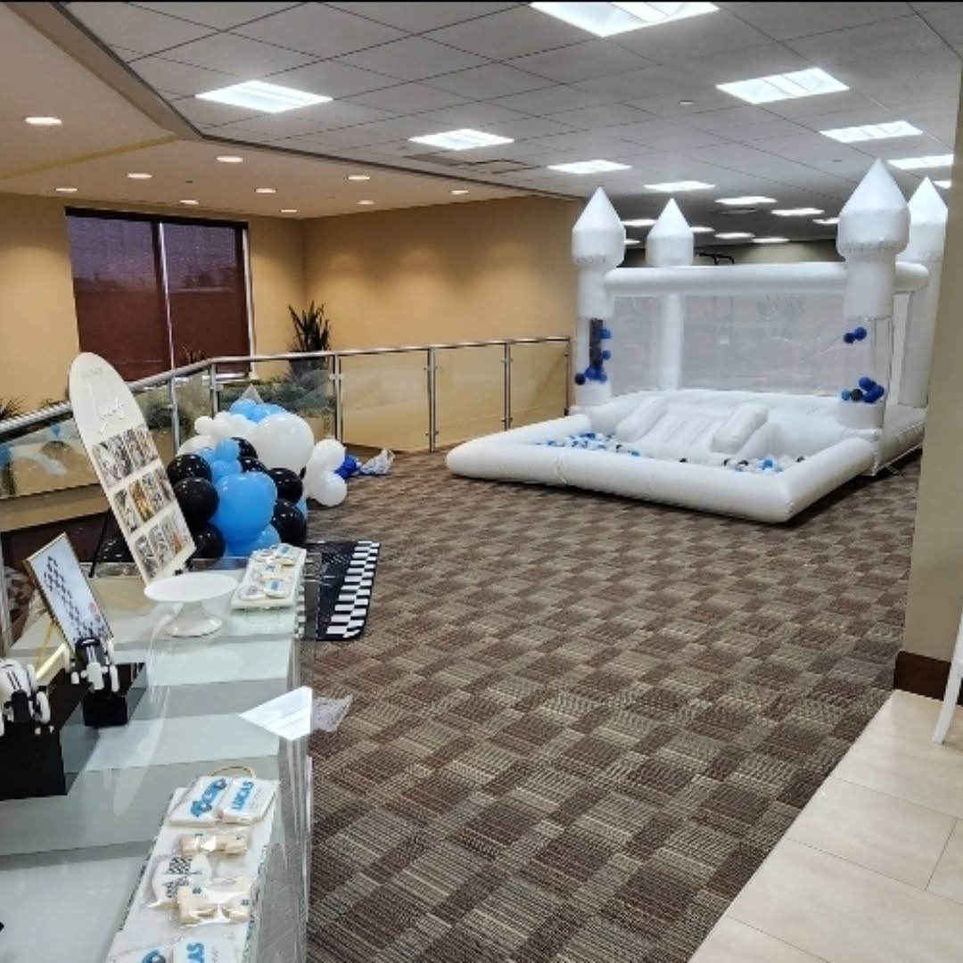 Mini bouncy castle with slide and ballpit from Aura Luxury Rental Ltd, featuring colorful inflatable play area for children.