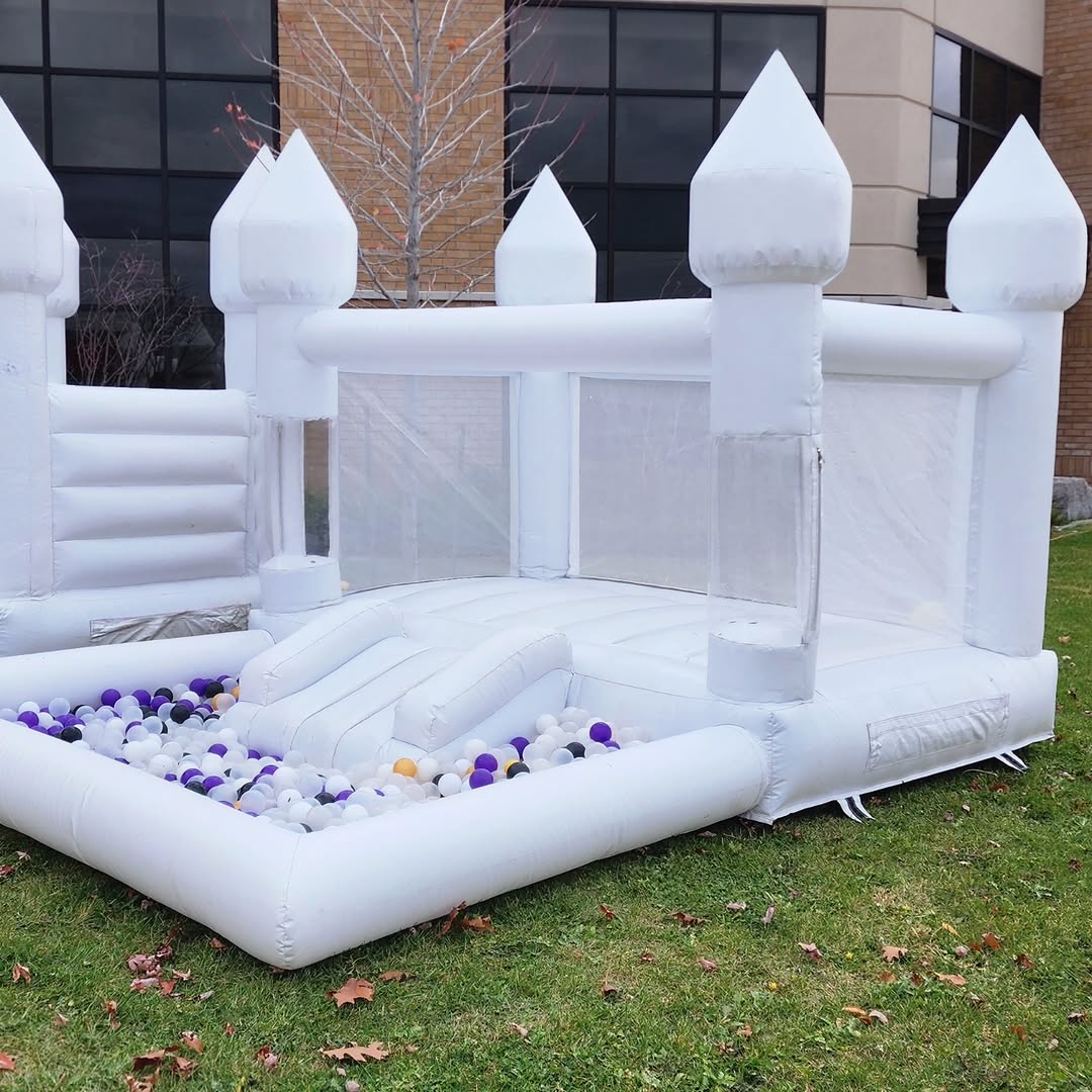 Mini bouncy castle with slide and ballpit from Aura Luxury Rental Ltd, featuring colorful inflatable play area for kids.