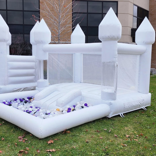Mini bouncy castle with slide and ballpit from Aura Luxury Rental Ltd, featuring colorful inflatable play area for kids.