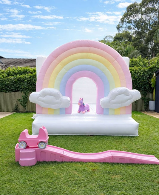 Colorful rain-themed bounce house for kids by Aura Luxury Rental Ltd, featuring bright raincloud and umbrella decorations.