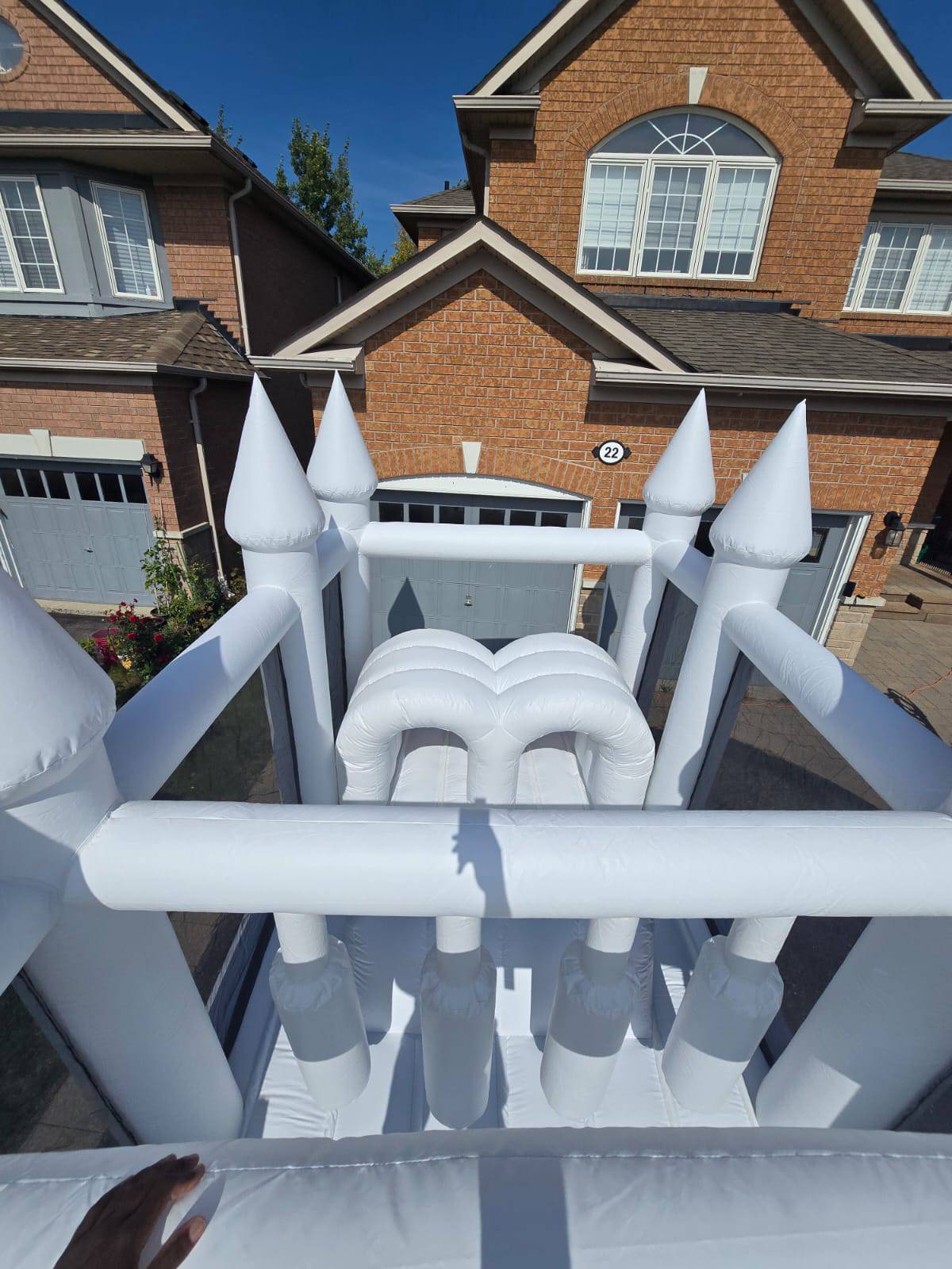 Colorful obstacle course with ball pit and waterslide from Aura Luxury Rental Ltd, suitable for kids' outdoor play areas.