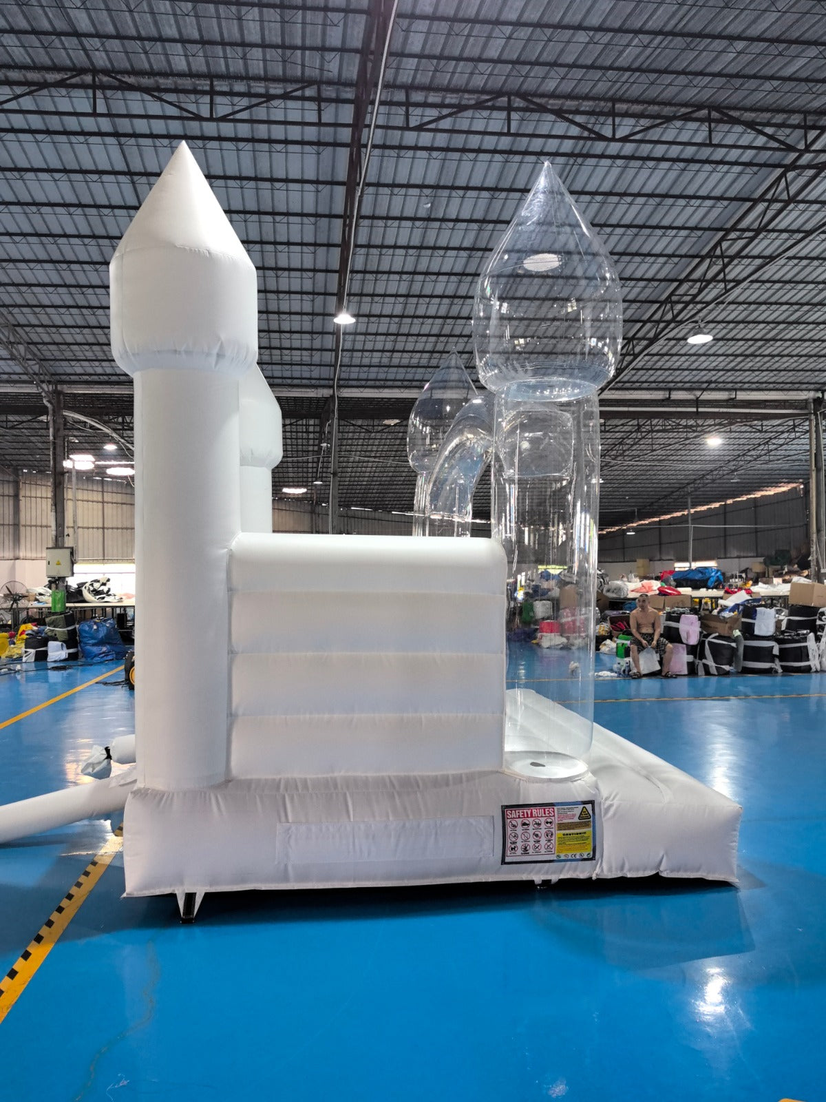 Colorful balloon pillar bounce house for kids by Aura Luxury Rental Ltd, featuring bright balloons and spacious jumping area.
