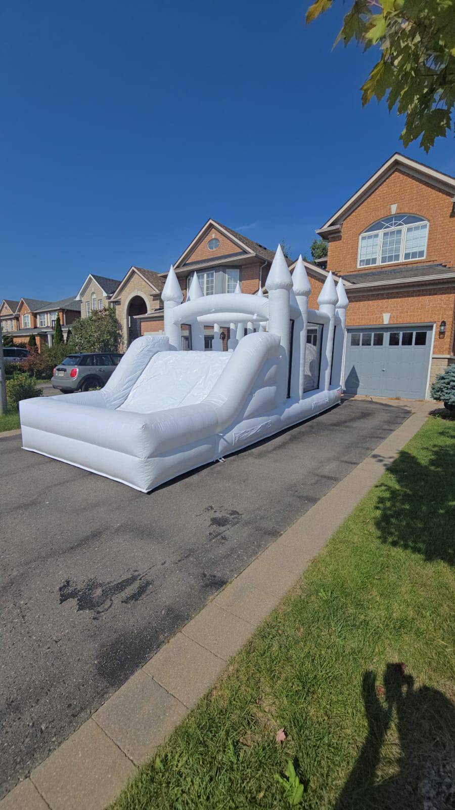 Colorful obstacle course with ball pit and waterslide by Aura Luxury Rental Ltd, featuring vibrant slides and soft play areas for kids.